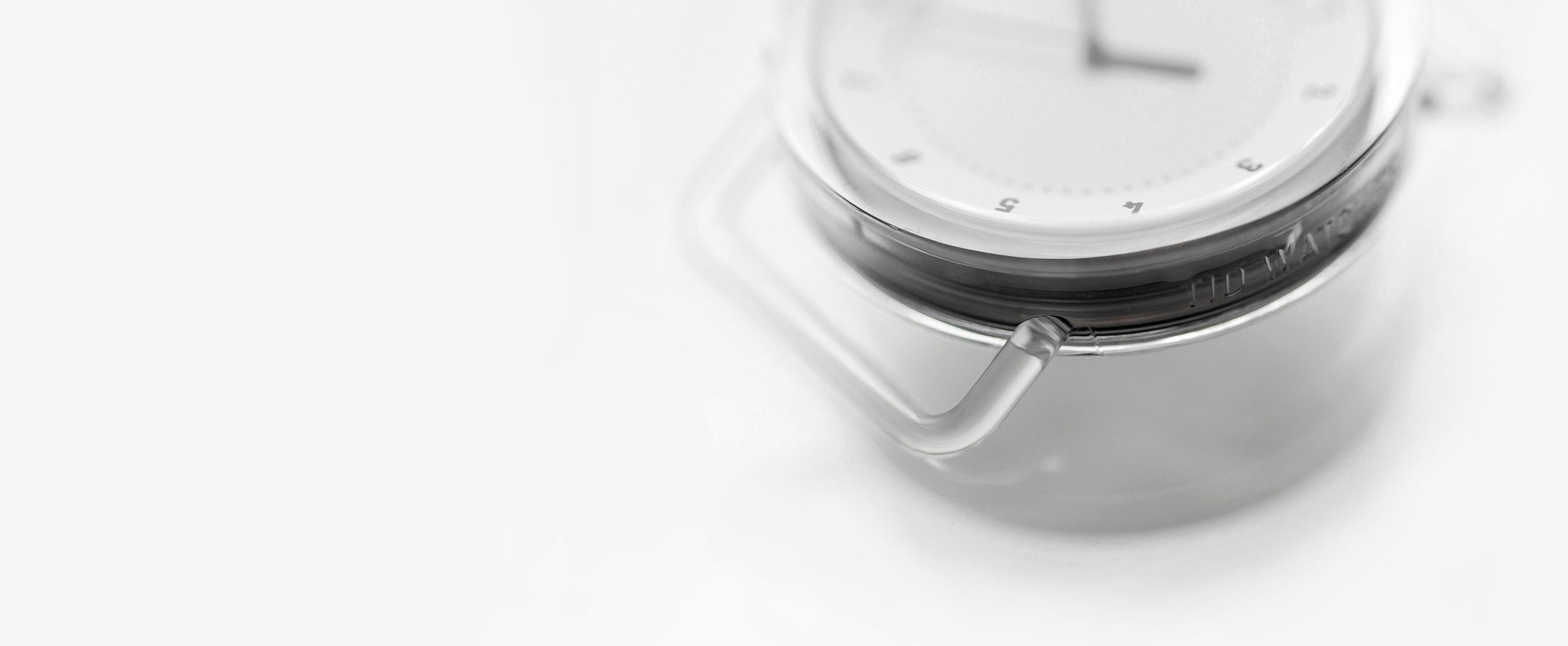 Close-up of TID No.3 transparent TR90 watch case showing lightweight material detail