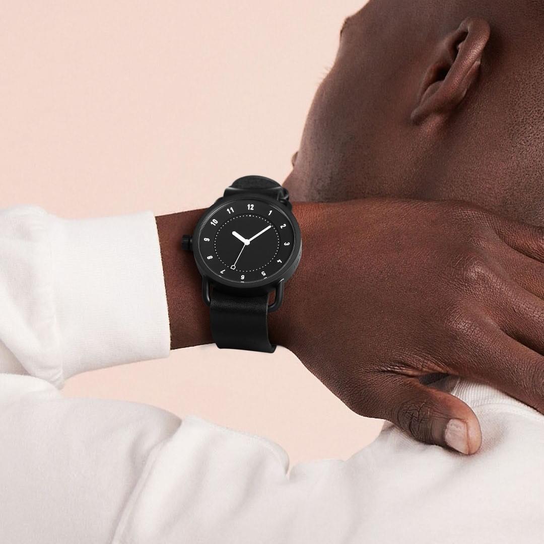 TID No.1 black dial minimalist watch worn with white shirt
