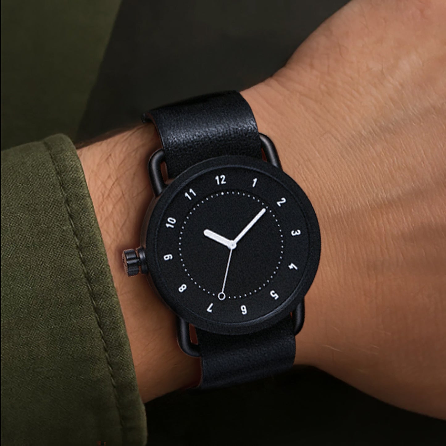 TID No.1 black dial watch worn with dark green sleeve