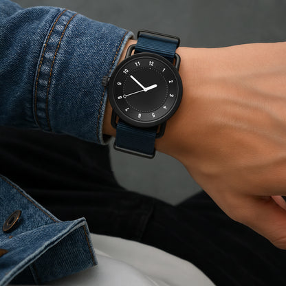 TID No.1 black dial watch worn with denim jeans for everyday style