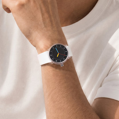 TID No.3 lightweight Swedish watch with white silicone strap and black dial worn with white T-shirt